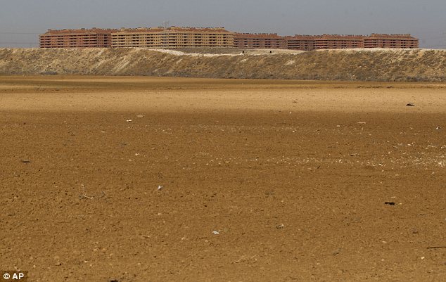 Phantom: Landscaped areas, which were due to be constructed on, lie vacant on the outskirts of ghost town Sesena as the Spanish housing crisis continues to take its hold