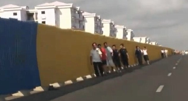 Handful: Chinese workers were the only people seen on the streets of the city